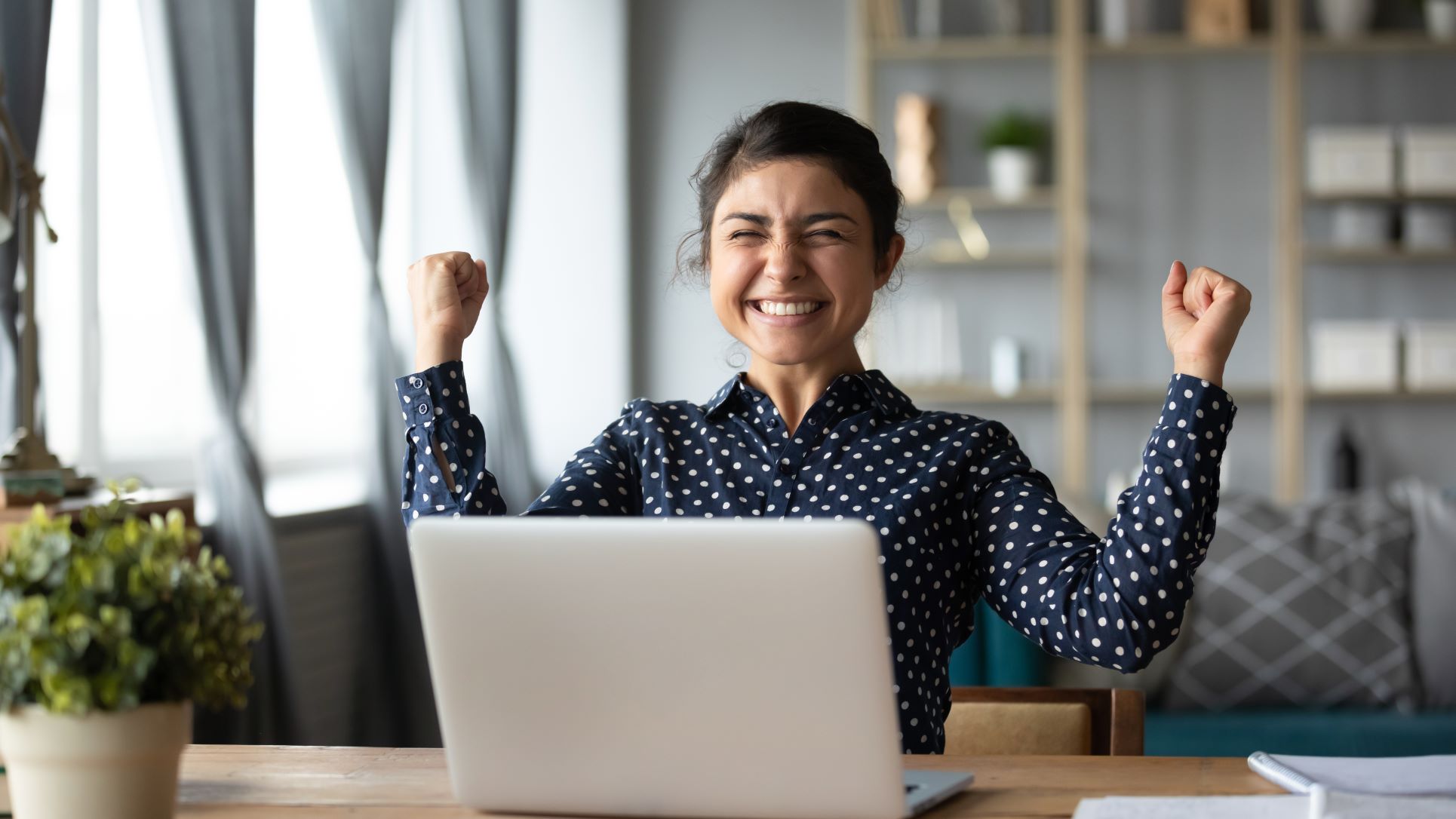 Excited woman reaches her goals by using progress principle